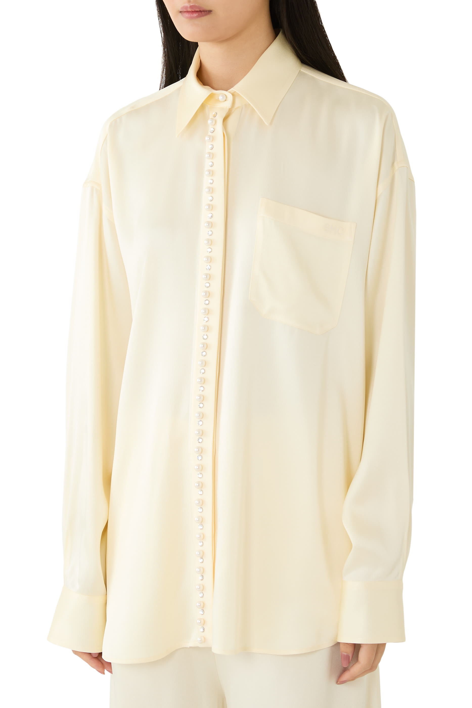 قميص مزين بلؤلؤ