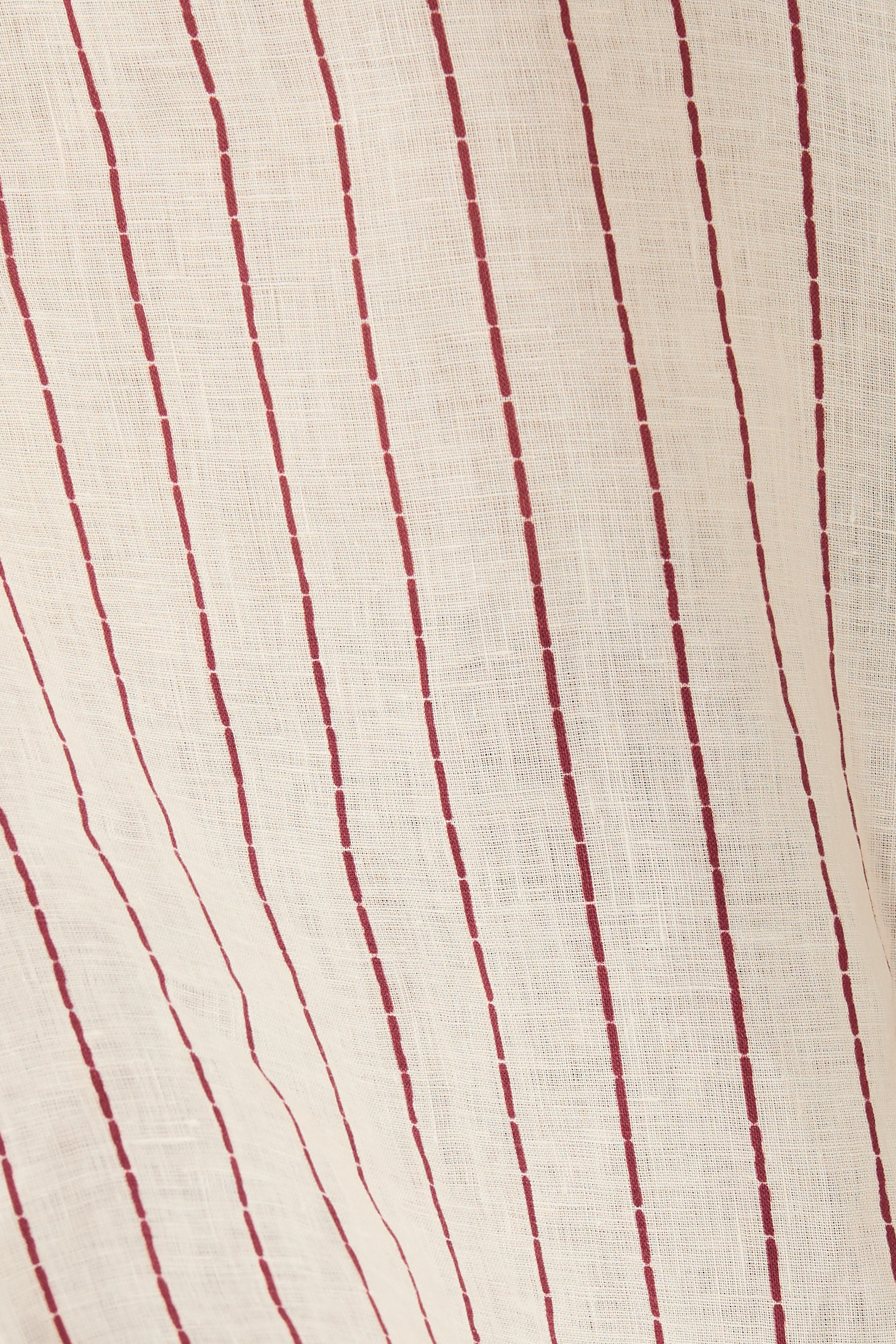 بلوزة ريزورت كابسول بلا أكمام مزينة بطبعة خطوط كتان