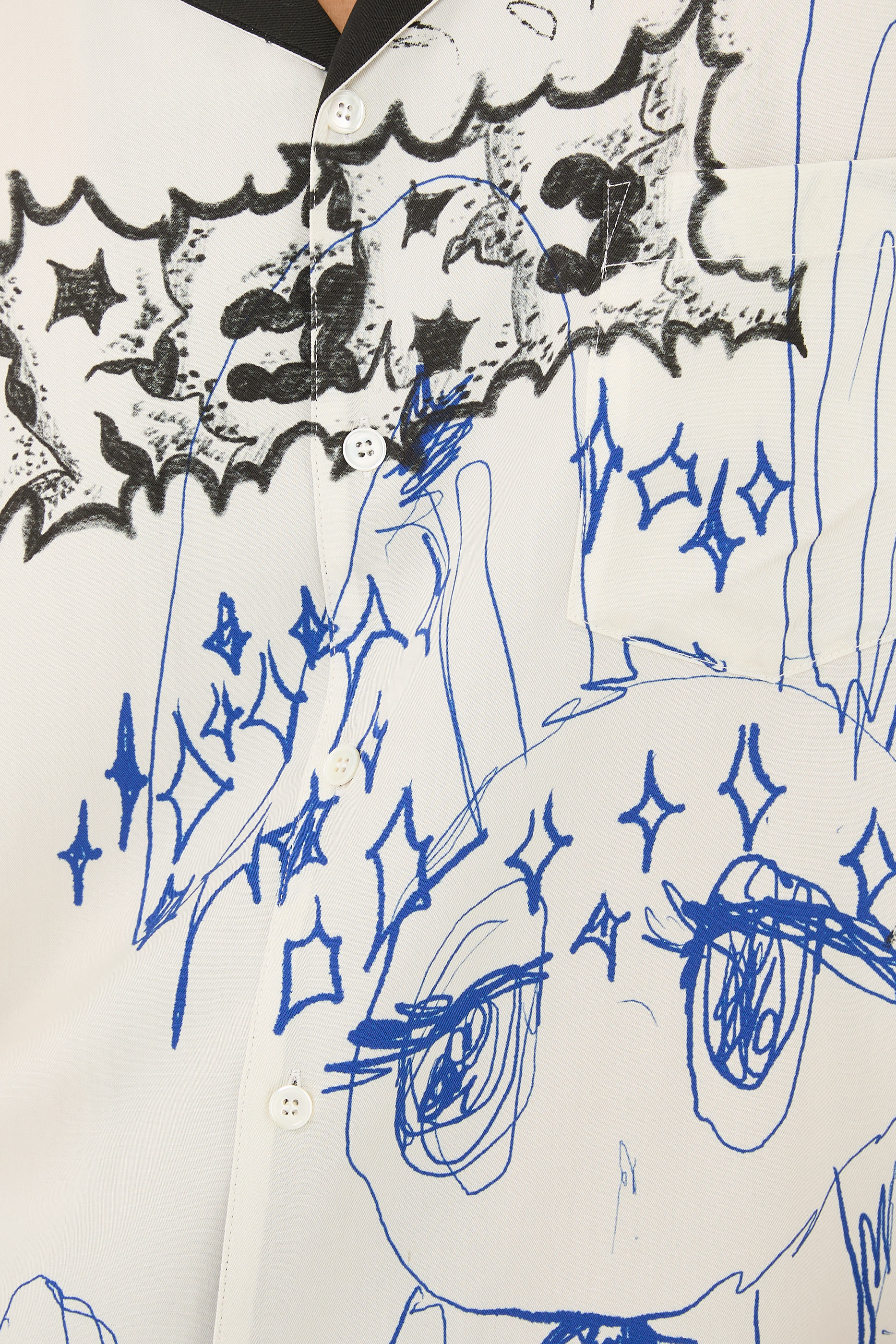 قميص بياقة مطوية ونقشة