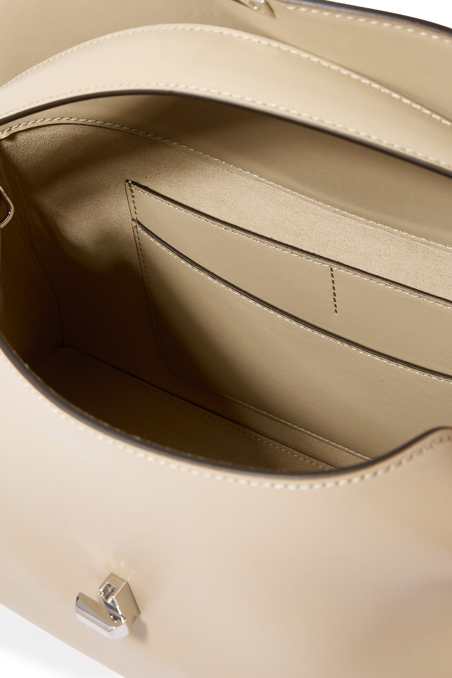 حقيبة يد بإغلاق على شكل حرف T جلد